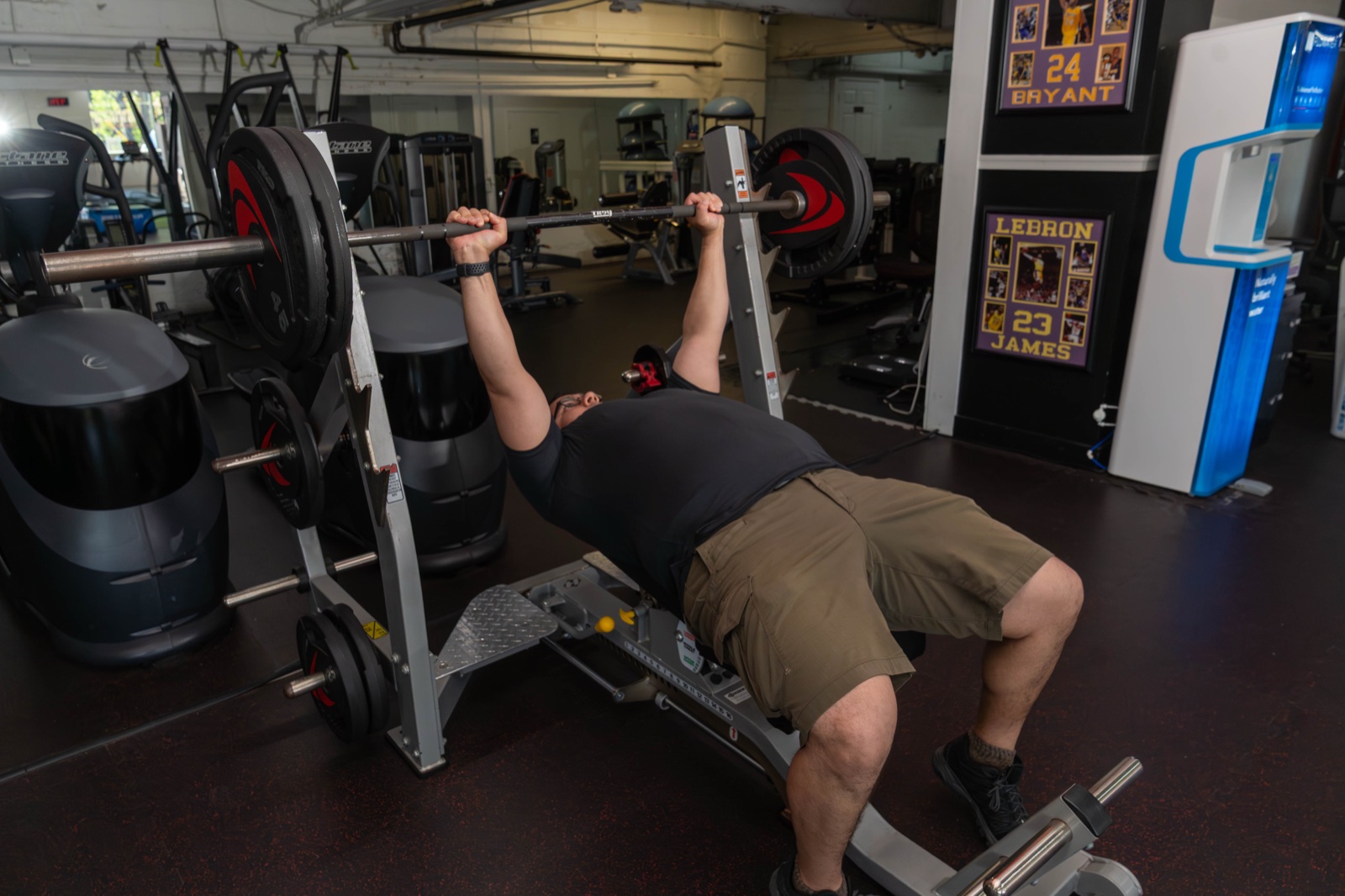 A member benching at the strength rack
